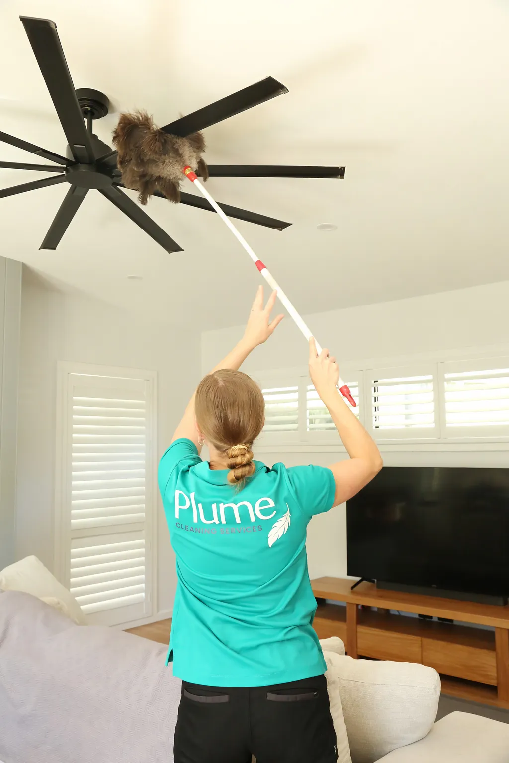 Alice cleaning a fan