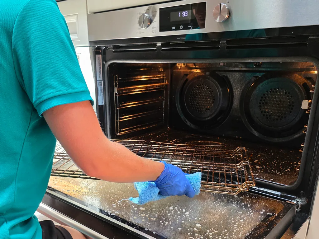 Alice cleaning an oven