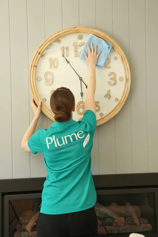 Kara cleaning a clock